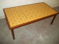 A RETRO TEAK TILE TOPPED COFFEE TABLE