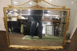 A FRAMED DECORATIVE MIRROR