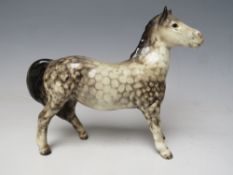 A BESWICK GIRLS PONY IN ROCKING HORSE GREY GLOSS MODEL 1483Condition Report:Very dusty - in need