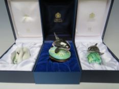 THREE ANIMAL THEMED HALCYON DAYS ENAMEL PILL BOXES IN RELIEF, comprising a 'Bottlenose Dolphin', and