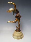AN ART DECO STYLE BRONZED METAL FIGURE OF DANCER, with an ivorine face, hands and torso, supported