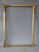 A LATE 19TH / EARLY 20TH CENTURY DECORATIVE GOLD WATERCOLOUR FRAME, with corner embellishments,