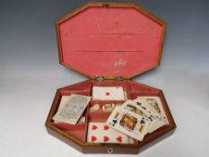 A GEORGIAN PARTRIDGE WOOD OCTAGONAL CARD/GAMES BOX, with inlaid and crossbanded detail, W 30 cm