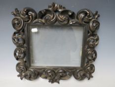 A 19TH CENTURY CONTINENTAL EBONISED AND GILT CARVED DECORATIVE FRAME, glazed, frame W 7.5 cm, rebate