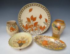 THREE CHARLOTTE RHEAD PIECES INCLUDING A 4921 GOLDEN LEAVES CHARGER, comprising an oval floral dish,
