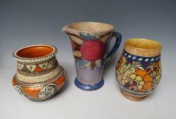 THREE PIECES OF CHARLOTTE RHEAD FOR CROWN DUCAL, comprising a floral jug and two baluster vases, all