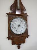 A LARGE EARLY 20TH CENTURY CARVED OAK ANEROID BAROMETER, H 106 cm