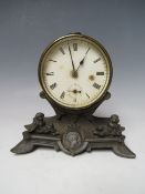A VICTORIAN DRUM HEAD MANTEL CLOCK, the circular dial raised on a cherubic stand, H 15.5 cm S/D