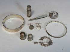 A CELTIC STYLE HALLMARKED SILVER BROOCH AND BANGLE, together with a London hallmarked silver bangle,