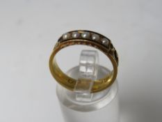 A VICTORIAN 15CT GOLD, SEED PEARL AND ENAMEL MOURNING RING, with alternating woven hair and engraved