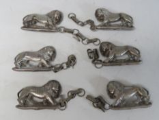 A SET OF SIX WHITE METAL LION CAPE CHAIN CLASPS ?, each lion approx 5 cm
