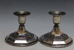 A PAIR OF WHITE METAL SQUAT CANDLESTICKS OF UNUSUAL DESIGN, H 8.5 cm