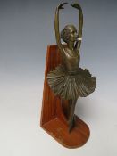 A DECORATIVE BRONZED STYLE BALLET DANCER, mounted on a hardwood plinth, H 26.5 cm