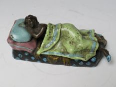 A VINTAGE COLD PAINTED BRONZE FIGURE DEPICTING A NAKED FEMALE UNDER A LOOSE COVER, bearing stamp
