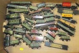 A SELECTION OF VARIOUS HORNBY DUBLO AND TRIX MODEL RAILWAY TRUCKS AND COACHES