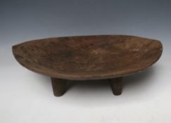 A POLYNESIAN STYLE KAVA BOWL, raised on four tapered feet, W 46 cm