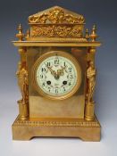A FRENCH BRASS / BRONZE GILDED MANTEL CLOCK, the movement stamped S. Marti, retailed by Harris of