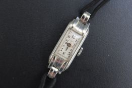 ROLEX - AN SLIMLINE ART DECO 18CT WHITE GOLD 'PRINCESS' WRIST WATCH, W 1.25 cm