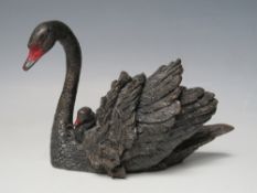AN AUSTRIAN COLD PAINTED MODEL OF A BLACK SWAN AND CYGNET STAMPED GESCHUTZT, W 13.5 cm, H 9.5 cm