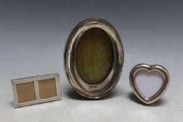 THREE SMALL SILVER PICTURE FRAMES