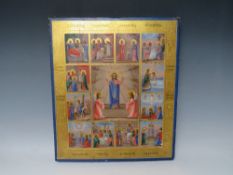 A RUSSIAN ICON ON PANEL, the central work surrounded by twelve smaller scenes, gilt decoration and