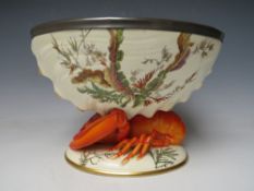 A WEDGWOOD STYLE 'LOBSTER' FOOTED CREAMWARE SALAD BOWL, decorated in naturalistic background,