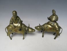 A PAIR OF ORIENTAL BRONZED BUFFALO INCENSE BURNERS, each with separate covers modelled as figures in