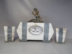 AN ART DECO CLOCK GARNITURE, showing a female dancer on variegated marble case, the eight day French