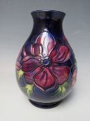 A MOORCROFT LIMITED EDITION ANEMONE PATTERN VASE, number 34 / 94, of bulbous form, impressed and