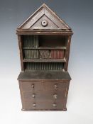 A LATE 19TH CENTURY MINIATURE COUNTRYMADE LIBRARY BOOKCASE, with four drawers to the base, H 36