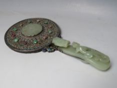 A CHINESE SILVER AND ENAMEL HAND MIRROR MOUNTED WITH JADE, the handle made from a carved jade belt