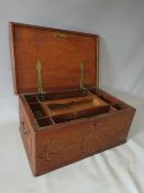 AN ANTIQUE CARVED ZANZIBAR DOWRY CHEST, with twin handles, the hinged lid opening to a fitted