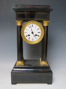 A FRENCH EBONISED PORTICO CLOCK, the architectural case with four pillars having decorative gilt