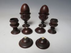 A COLLECTION OF VARIOUS ITEMS OF TREEN, to include small lidded urns and two eggs