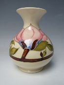 A MOORCROFT PINK MAGNOLIA PATTERN VASE, of bulbous for with flared rim, impressed and painted