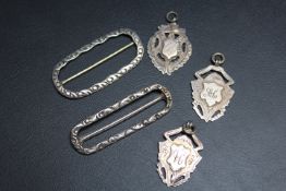 THREE SILVER WATCH FOBS AND TWO BUCKLES, (5)