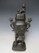 AN EARLY 20TH CENTURY ORIENTAL BRONZED KORO AND COVER, the cover with dog of fu, stylised floral