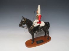 A BESWICK CONNOISSEUR SERIES LIFEGUARD, a trooper in mounted review order dressed for ceremonial