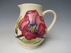 A MOORCROFT MAGNOLIA PATTERN JUG, painted marks to base, H 14 cm
