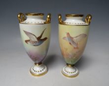 A SMALL PAIR OF MINTONS CABINET VASES, each decorated with game birds, both signed by J E Dean,
