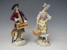 A PAIR OF CONTINENTAL PORCELAIN FIGURINES IN CLASSICAL DRESS, crossed marks to base, tallest H 17.