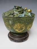 A CHINESE BRONZED AND GILT METAL FORTUNE OR TREASURE BOWL, decorated throughout with bats,