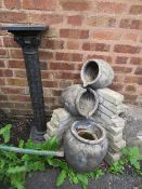 A DECORATIVE WATER FEATURE AND A RESIN PEDESTAL (2)
