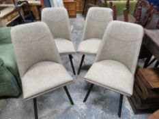 A MODERN SET OF FOUR UPHOLSTERED DINING CHAIRS