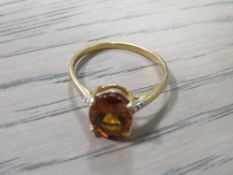 A 10K LADIES GEMSET RING - SIZE R 1/2