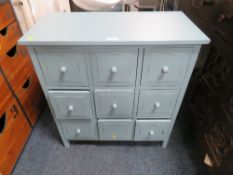 A MODERN NINE DRAWER MULTI- CHEST W-69 CM