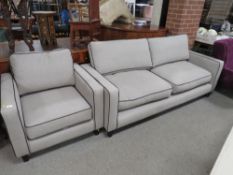 A MODERN UPHOLSTERED TWO PIECE GREY SUITE