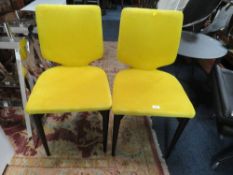 A PAIR OF MODERN YELLOW DINING CHAIRS