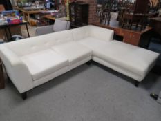 A MODERN UPHOLSTERED CORNER SETTEE