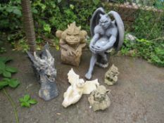 A HEAVY STONE GARGOYLE H-46 CM WITH OTHER STONE AND PLASTIC ORNAMENTS